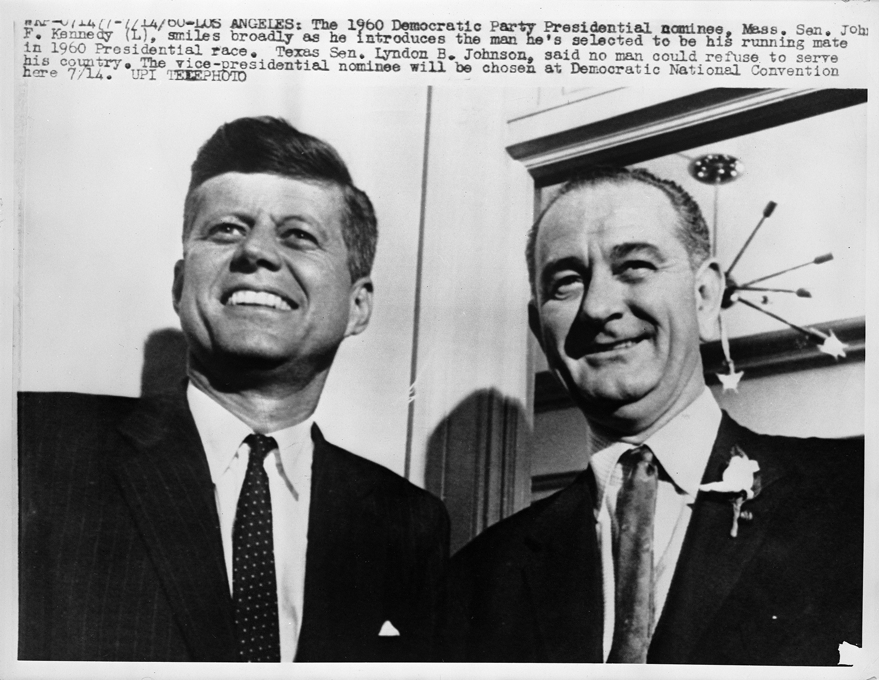 John F. Kennedy and Lyndon B. Johnson in medium closeup, both smiling.
